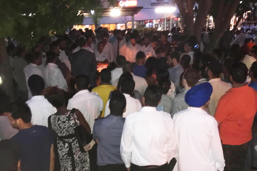 Hundreds gather at a vigil honouring Brisbane City Council bus driver Manmeet Alisher