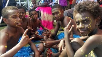 A group of children at the Bougainville Day celebrations in Port Moresby in 2019. Their faces are painted with yellow dots.