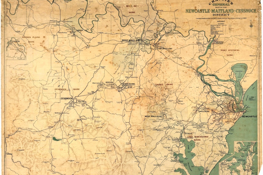 An old map of the Newcastle-Maitland area on aged paper.