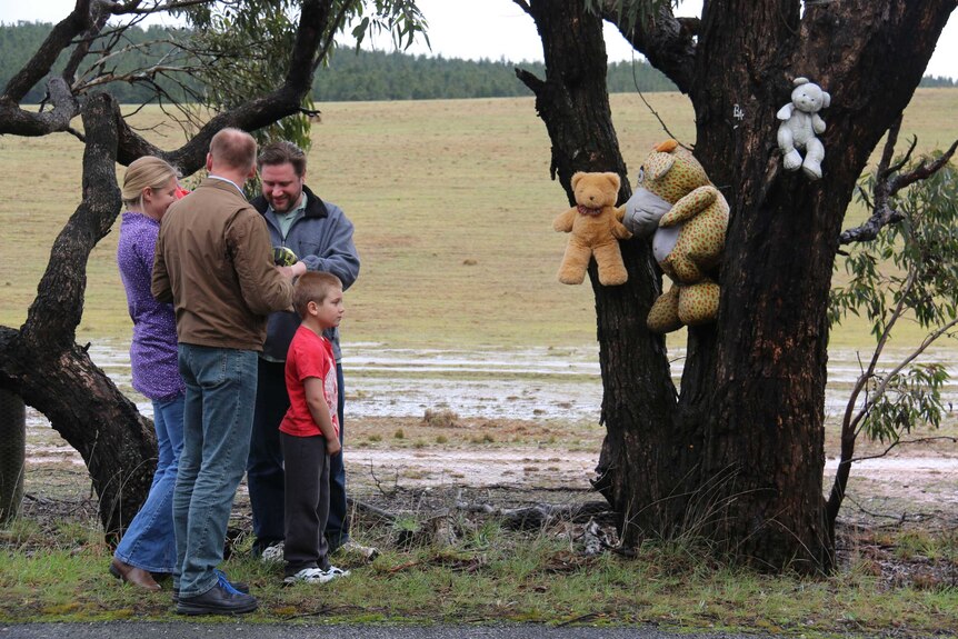 Questioner Rachel Przeslawski hangs a bear with her family.