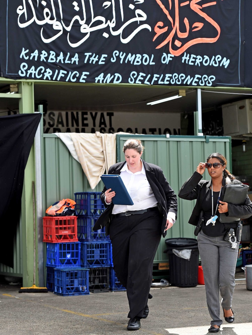 NSW detectives leave a Shia Muslim prayer hall in Sydney