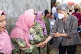 Foreign Minister Penny Wong shakes the hands of Indonesian women