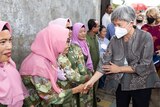 Foreign Minister Penny Wong shakes the hands of Indonesian women