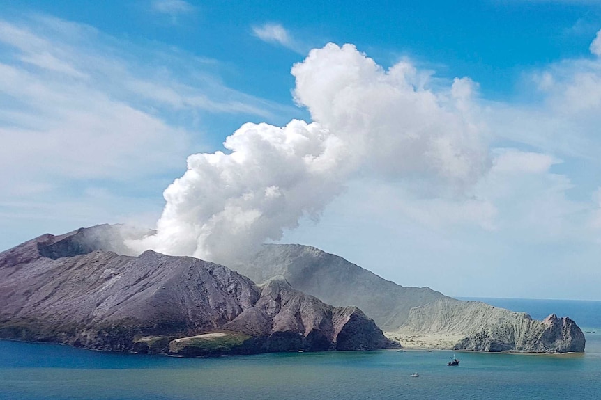 Smoke is seen rising from a volcanic island