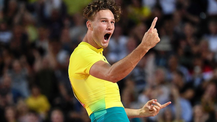 A mid shot of Australian pole vaulter Kurtis Marshall celebrating with his finger in the ai at the Commonwealth Games.