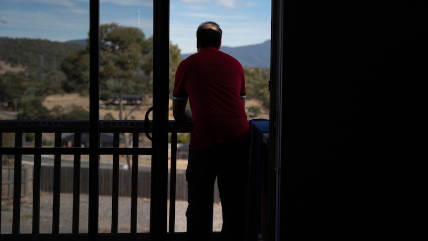 A man standing on the balcony.