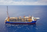 A large cargo ship carrying condensate in the ocean.