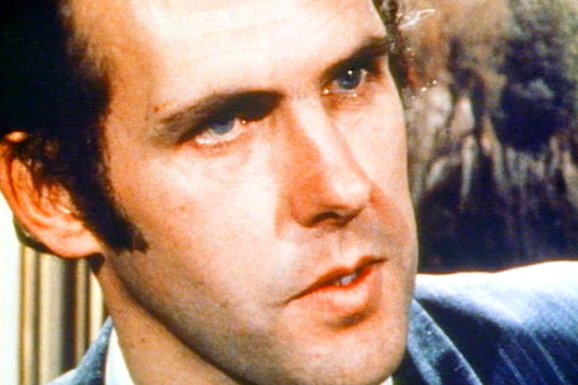 A close up of Bob Brown's face looking stern