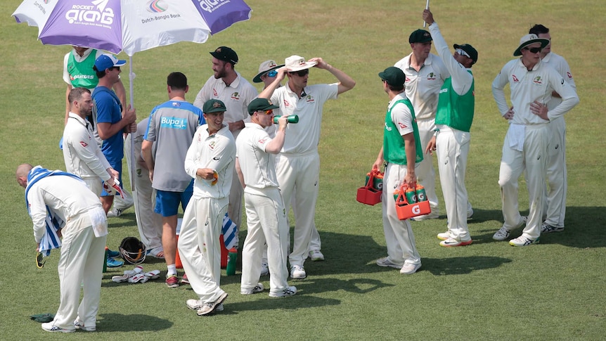 Australian players chatting to each other during a drinks break in Chittagong.