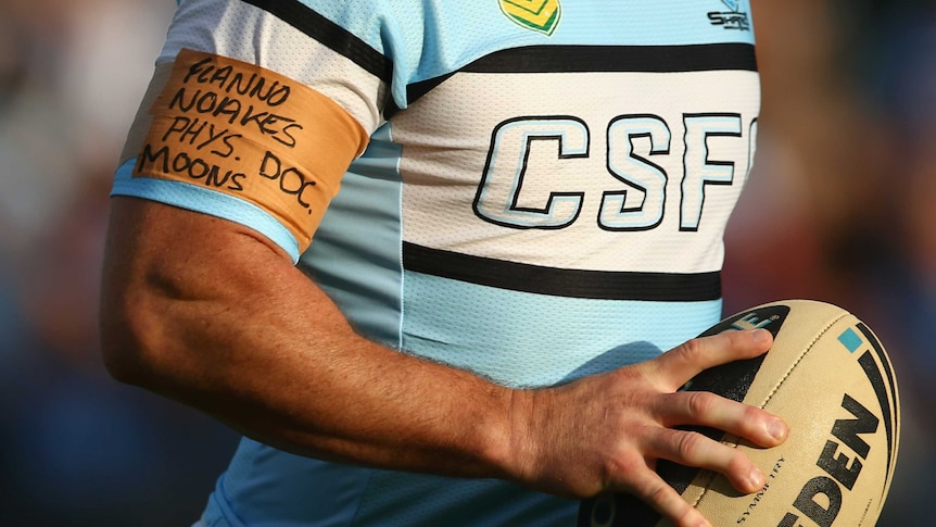 The Sharks' Paul Gallen wears an arm band featuring names of sacked and stood down Cronulla staff.