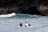 The SY Patriot crew searches for debris from the wrecked yacht Navillus.