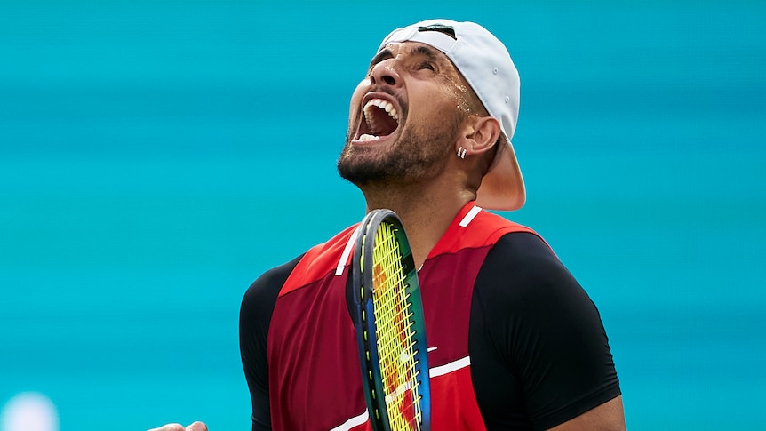 Nick Kyrgios screams and looks up to the sky