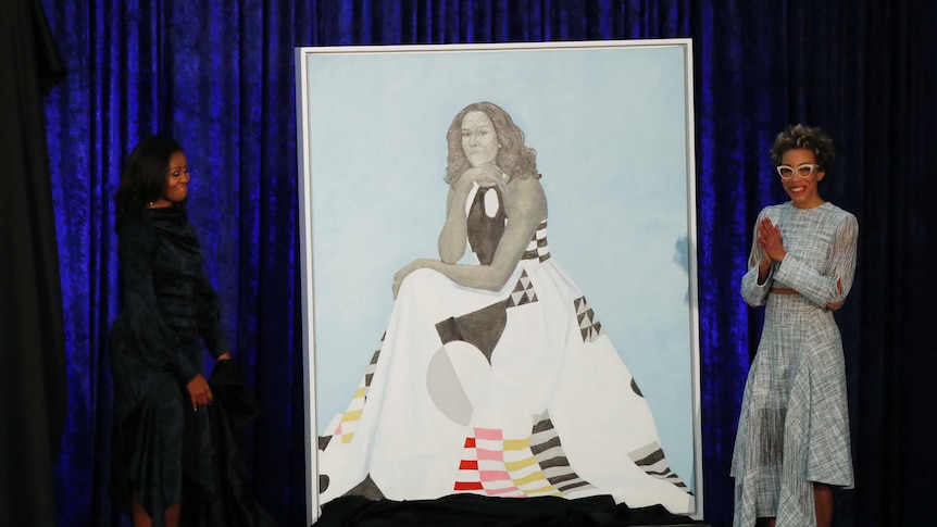 Former first lady Michelle Obama beside her official portrait
