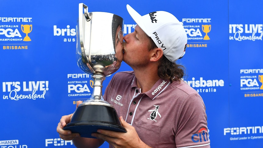 Cameron Smith kisses the trophy after winning the Australian PGA Championship.