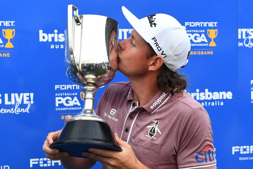 Cameron Smith kisses the trophy after winning the Australian PGA Championship.