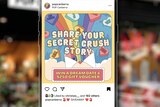 An iPhone with an Instagram post on the screen that reads "Share your secret crush story".