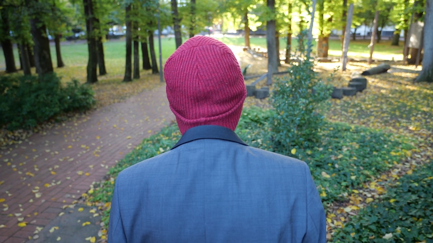 a man wearing a beanie and a jacket