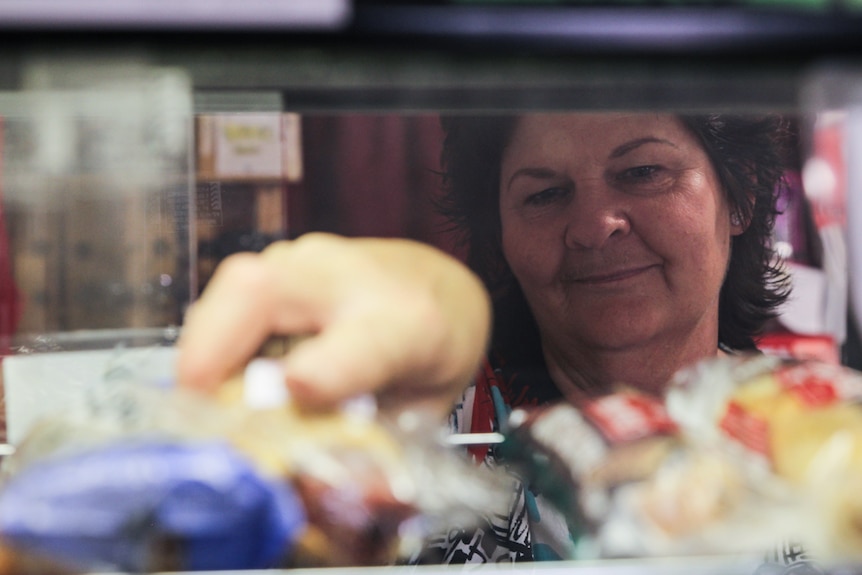 Wendy Aves restocks the pie warmer in the Ivanhoe Service Station.