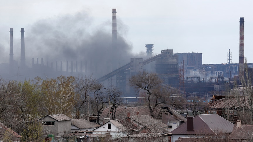 Smoke rises from an industrial plant.