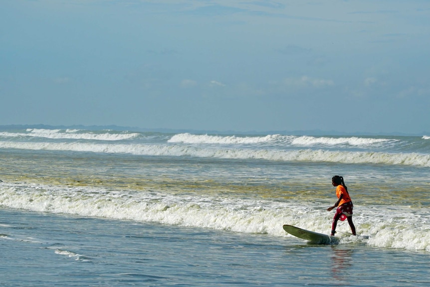 Mayesa surfing at Cox's beach in Bangladesh