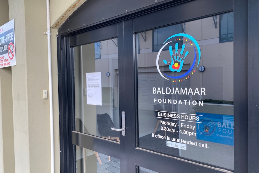 Front door Of baldjamaar foundation with contact details, signage and a letter or lease temrination