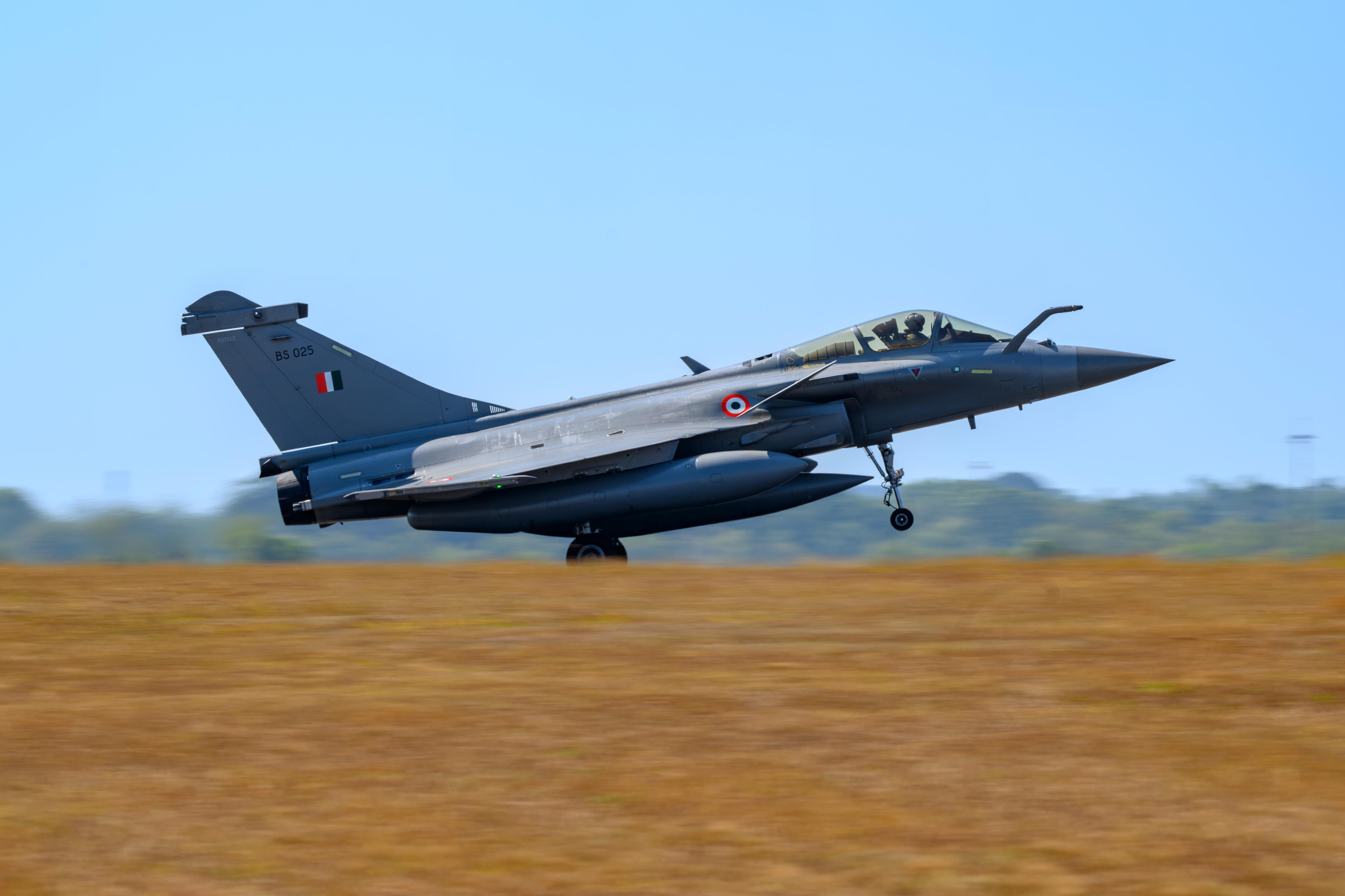 A fighter jet begins to take off.