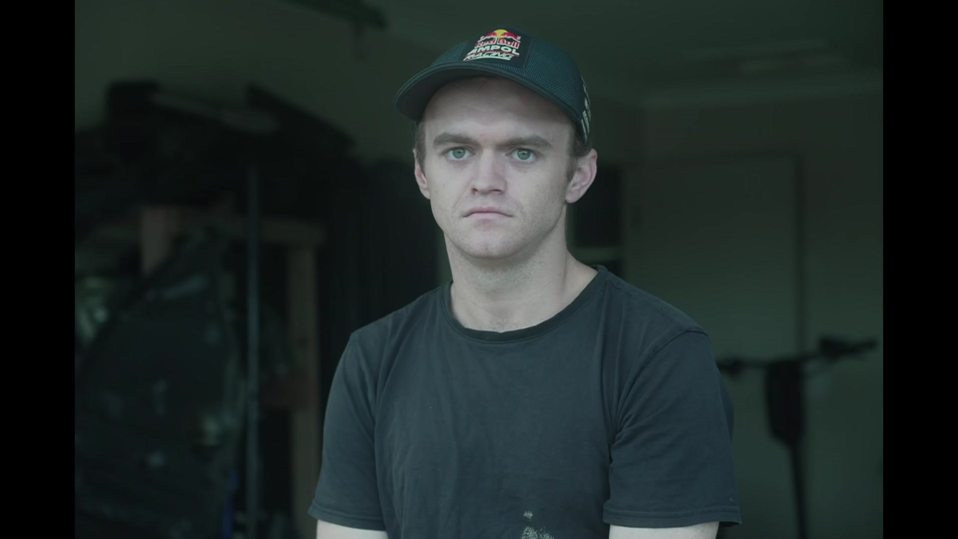 Chris Forsyth, a young man wearing a black shirt and cap. 