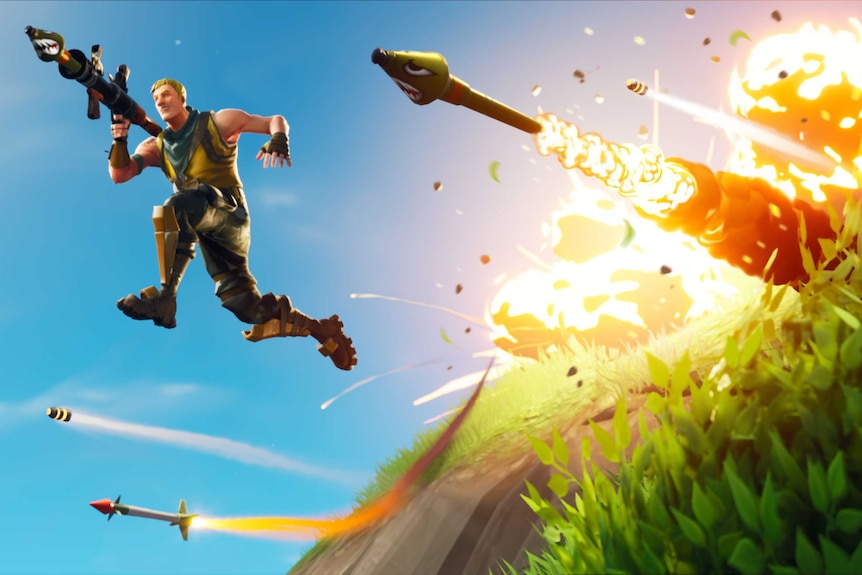 An image from the videogame Fortnite: Battle Royale with a man jumping away from an explosion