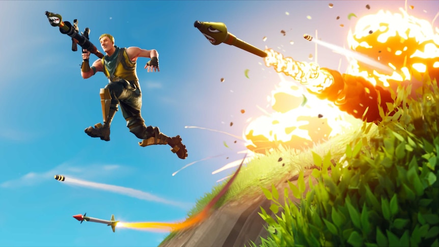 An image from the videogame Fortnite: Battle Royale with a man jumping away from an explosion