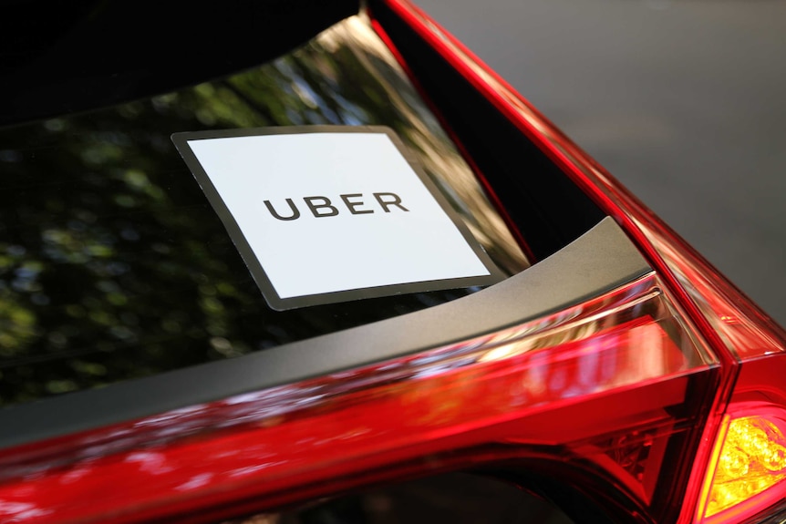 Uber sign on a car window