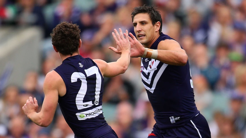 Lachie Neale and Matthew Pavlich celebrate a goal for Fremantle against Adelaide at Subiaco in 2014.