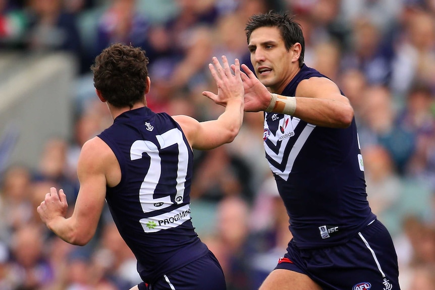 Lachie Neale and Matthew Pavlich celebrate a goal for Fremantle against Adelaide at Subiaco in 2014.