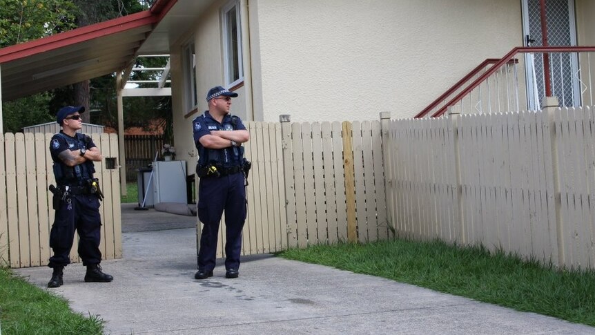 Police at a Woodridge house where a search is underway for a missing 22-month-old boy.