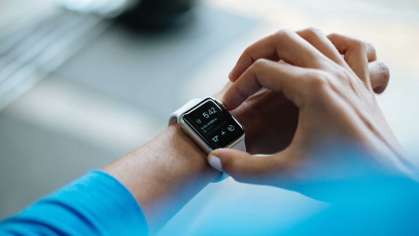 Close-up of a person wearing a smart watch