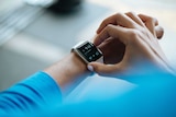 Close-up of a person wearing a smart watch