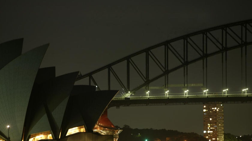 The global event began as the Sydney Opera House and Harbour Bridge plunged into darkness.
