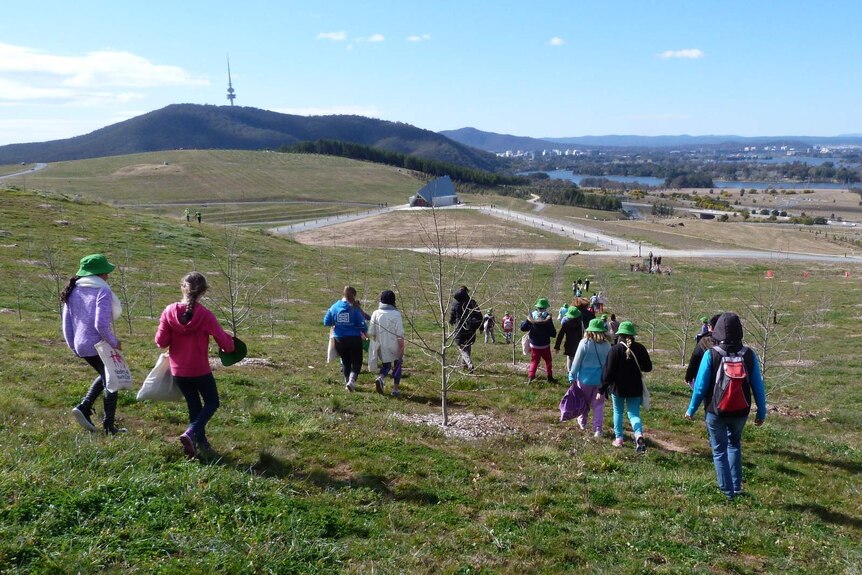 Woden Valley Youth Choir members walking down to the Visitors' Centre at the National Arboretum