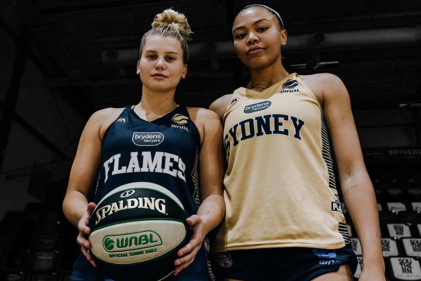Two WNBL players posing for a photo after training
