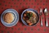 Haricot Mutton stew (pictured with lamb), and Irish soda bread on a read table cloth.