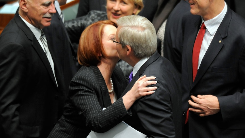 Julia Gillard kisses Kevin Rudd (AAP: Alan Porritt)