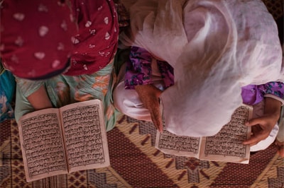 Internally displaced young girls from the Swat valley recite the Koran at a Madrassa in an IDP camp in Pakistan