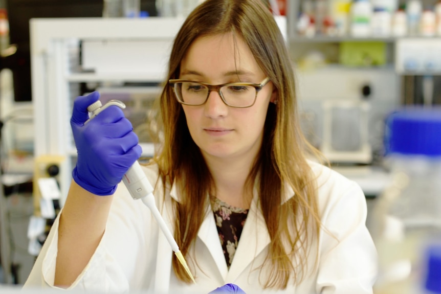 Dr Elena Schneider-Futshcik conducts a test in a laboratory.