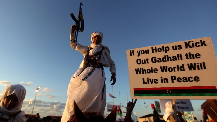 A Libyan rebel, member of the Warfala tribe parades on a horse in Benghazi