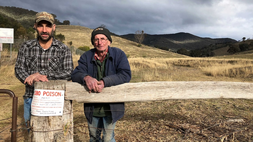 Two farmers Swifts Creek farmers Scott McCole and Ron Shelton at a gate post