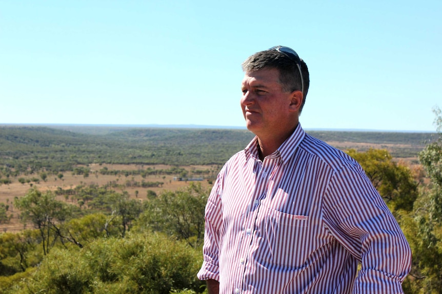 Shane McCarthy looks over the sight of one of his proposed dams