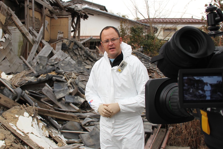 Mark Willacy does a piece to camera from Futuba, Japan.