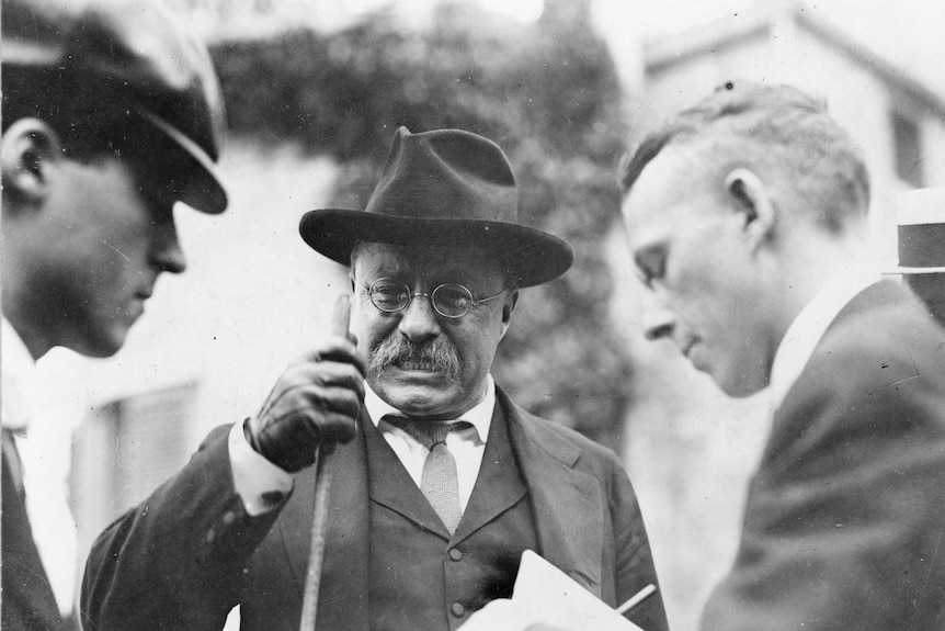 US President Theodore Roosevelt is interviewed by unidentified journalists, mid 1900s.