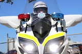 A police officer sits on a motorcycle in East Perth.