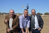 Deputy PM Warren Truss standing with a shovel full of dirt at the Stockman's Hall of Fame in Longreach.