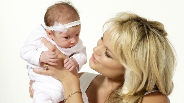 Lauren Goudy holds her baby daughter